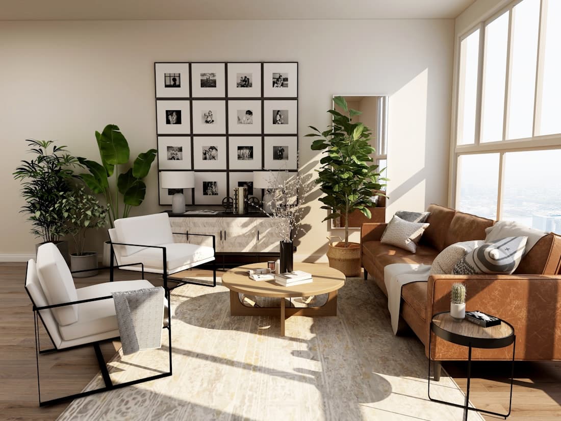 A bright living room with large windows, plants and a seating area
